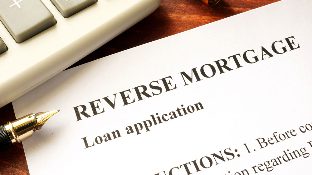 A reverse mortgage loan application on a table.